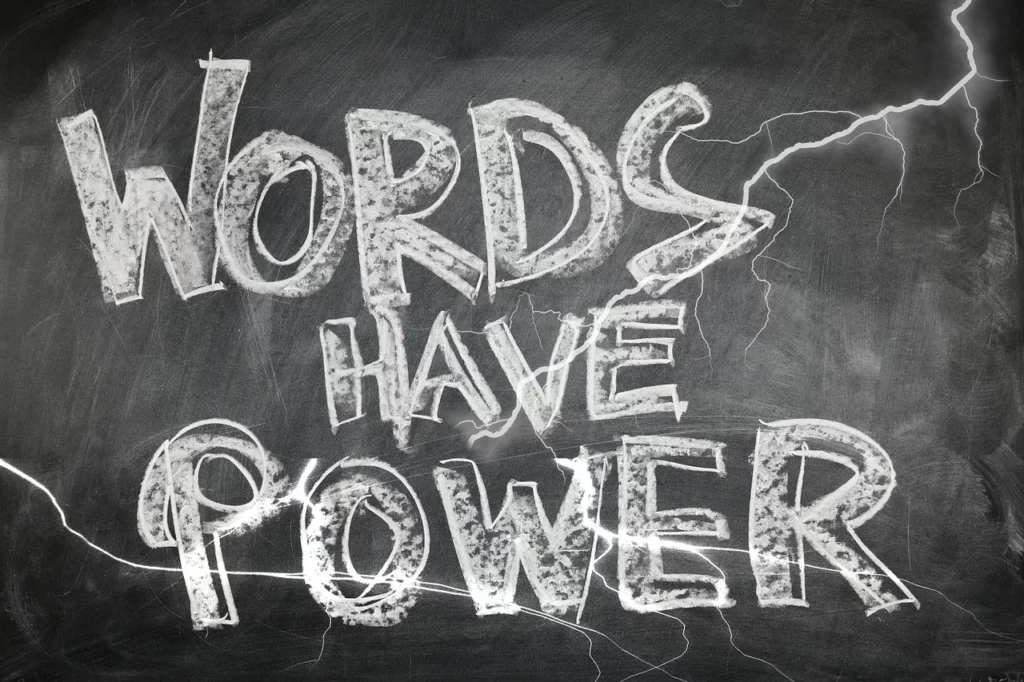 Words have power' against a backdrop of a painting